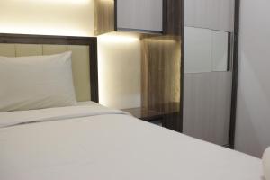 Pleasant 2BR at Grand Asia Afrika Apartment By Travelio