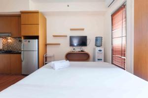 Homey and Cozy Living Studio at Pakubuwono Terrace Apartment By Travelio