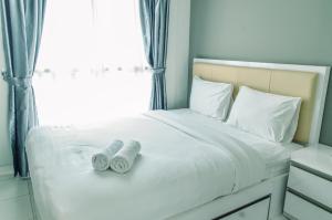 Homey and Comfy 1BR at Casa de Parco Apartment By Travelio