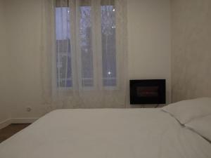 Appartements Cosy Appartement proche Paris : photos des chambres