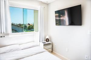 Apartamento a 500m da Praia com Vista do Mar, Ar-Condicionado, Churrasqueira, Rede de Descanso e Cozinha Completa