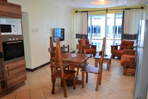 Cowrie Shell Beach Apartments Official