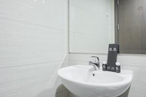 Fancy and Nice 1BR at Ciputra International Apartment By Travelio