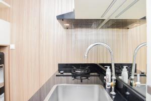 Comfort and Homey 2BR at Springlake Apartment Bekasi By Travelio