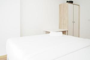 Homey and Comfy 1BR at M-Town Signature Apartment By Travelio