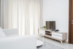 Homey and Comfy 1BR at M-Town Signature Apartment By Travelio