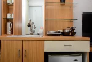 Fully Furnished with Cozy Design Studio Bassura City Apartment By Travelio