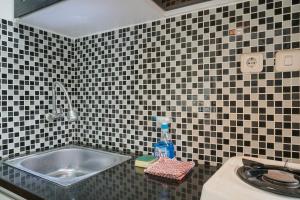 Homey Studio Margonda Residence 1 Apartment By Travelio