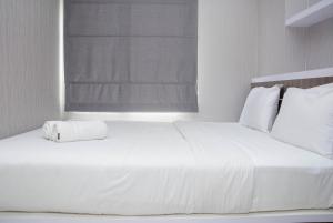 Cozy Stay 2BR Bassura City Apartment near Mall By Travelio