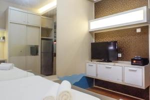 Trendy and Tidy Studio Room at Puri Mas Apartment By Travelio
