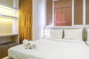 Trendy and Tidy Studio Room at Puri Mas Apartment By Travelio