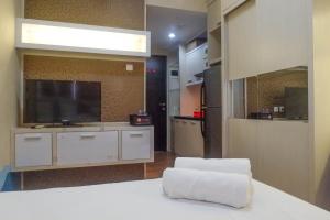 Trendy and Tidy Studio Room at Puri Mas Apartment By Travelio