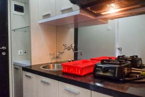 Trendy and Tidy Studio Room at Puri Mas Apartment By Travelio