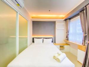 Cozy and Homey 1BR at Gateway Pasteur Apartment By Travelio