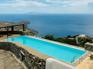 Andros -Stone house with shared pool & seaview