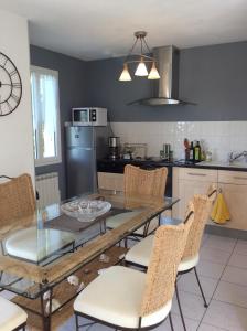 Appartements Jardin du Bourg : photos des chambres