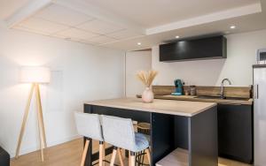 Appartements Le Cocon Ruthenois - Climatisation, Wifi, Netflix & Jardin : photos des chambres
