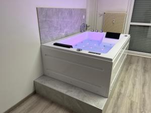 Appartements Appartement avec jacuzzi proche du centre : photos des chambres