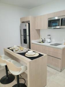 Acogedor Condo a metros de la 5ta Avenida