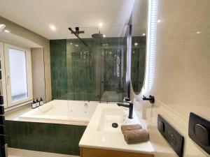 Appartements Suite Emeraude centre ville : photos des chambres