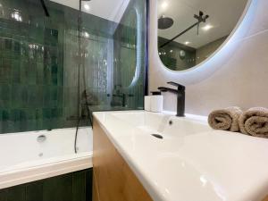 Appartements Suite Emeraude centre ville : photos des chambres