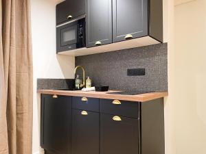 Appartements Suite Emeraude centre ville : photos des chambres