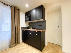 Appartements Suite Emeraude centre ville : photos des chambres