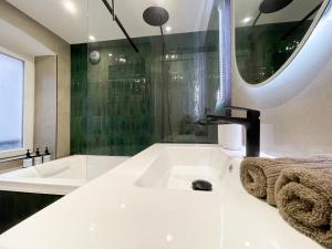 Appartements Suite Emeraude centre ville : photos des chambres