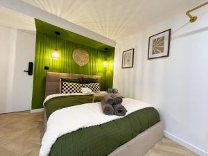 Appartements Suite Emeraude centre ville : photos des chambres