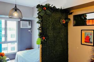 Condo at Avida Towers Riala T2 Bright, Cozy Studio with a Touch of Nature