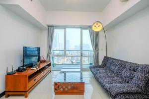 Homey and Warm 1BR Apartment at Ambassade Residence By Travelio