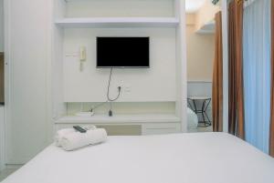 Minimalist and Comfy Studio at Grand Dhika City Apartment By Travelio