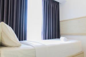 Clean and Comfort 2BR Apartment M-Town Residence By Travelio