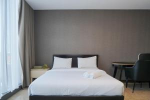Luxurious 1BR at LAvenue Apartment near Sampoerna Universitas By Travelio