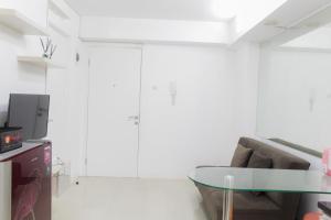 Homey and Cozy 2BR Bassura City Apartment near Mall By Travelio