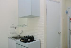 Comfort Studio at Green Pramuka City Apartment near Shopping Center By Travelio