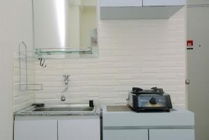 Comfort Studio at Green Pramuka City Apartment near Shopping Center By Travelio