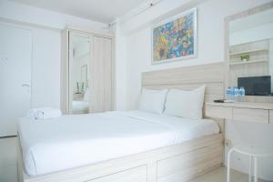 Cozy Stay and Homey Studio Apartment at Bassura City Apartment By Travelio