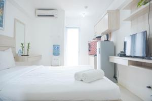 Cozy Stay and Homey Studio Apartment at Bassura City Apartment By Travelio