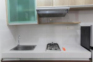 Cozy Living 1BR Apartment at Scientia Residences By Travelio