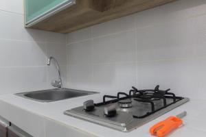 Cozy Living 1BR Apartment at Scientia Residences By Travelio