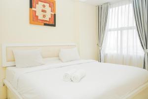 Fully Furnished with Comfortable Design 1BR Apartment Silkwood Residences By Travelio