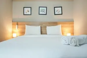 Elegant 1BR Apartment with Working Space Mustika Golf Residence By Travelio - Pegadungan