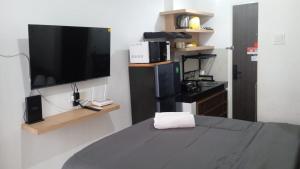 FREE WIFI, NETFLIX, SMART TV, MINERAL WATER, AMENITIES - Studio with Foldable Wall Bed at Serpong Garden Apt