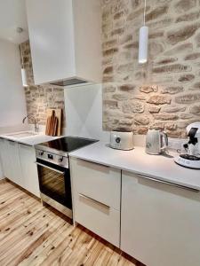 Appartements Maison Henriette - Au plus pres de la Cite Medievale : photos des chambres