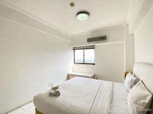 Comfort 2BR at Bona Vista Apartment By Travelio