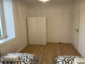 Appartements Appartement II - Haut Standing : photos des chambres