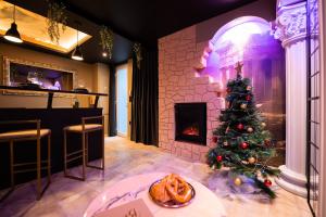 Appartements La Suite de Venus - Chambre a theme Love Room Jacuzzi et Piece Secrete - Evasion pour deux : photos des chambres