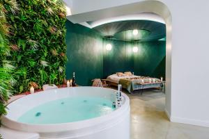 Appartements EROS - Loft entier avec Balneo & Retroprojecteur : photos des chambres