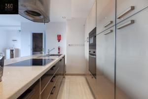 Penthouse and BBQ Kitchen Island & Massive living by 360 Estates